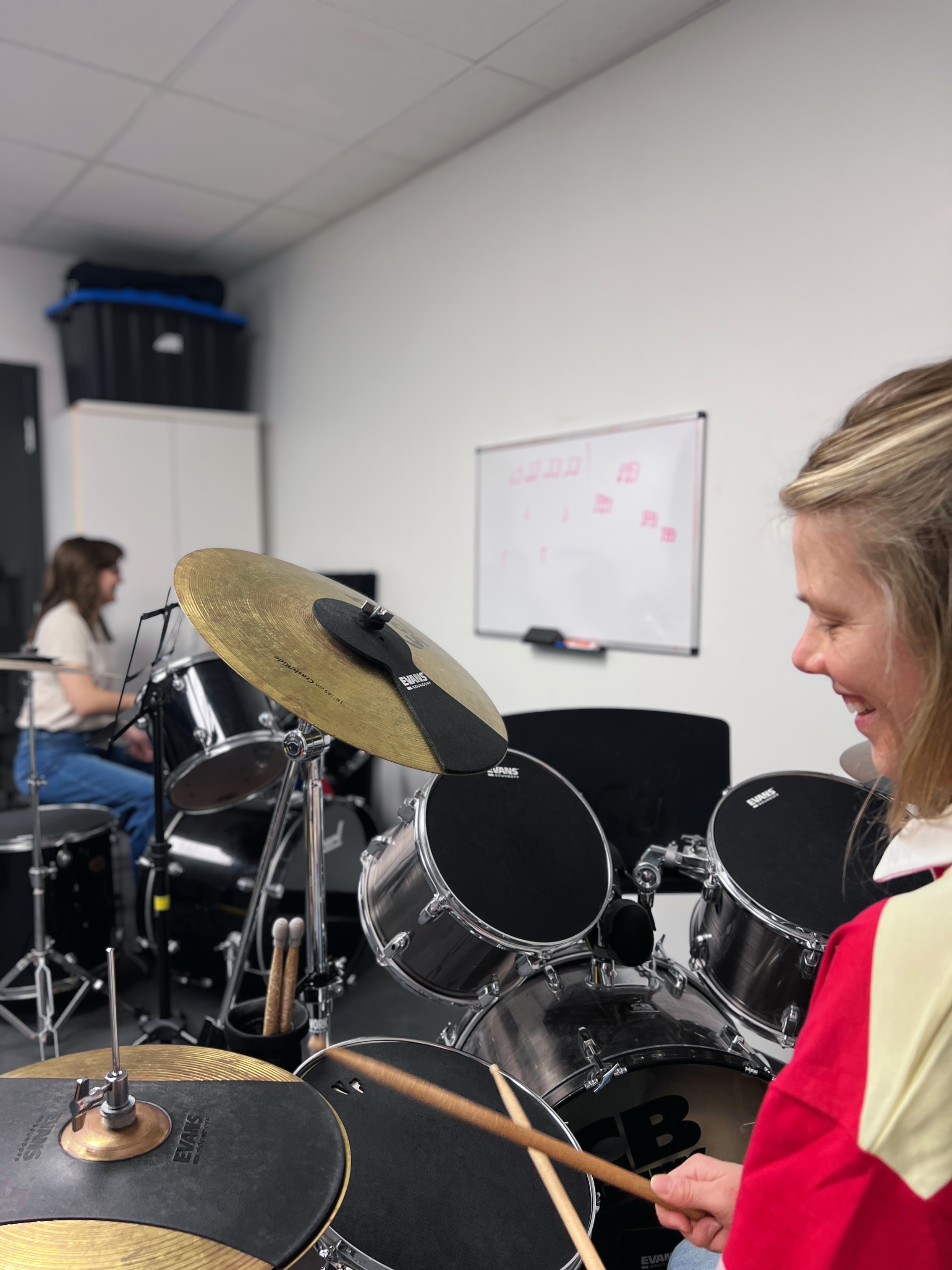 Student playing drums at Yellow Brick Music
