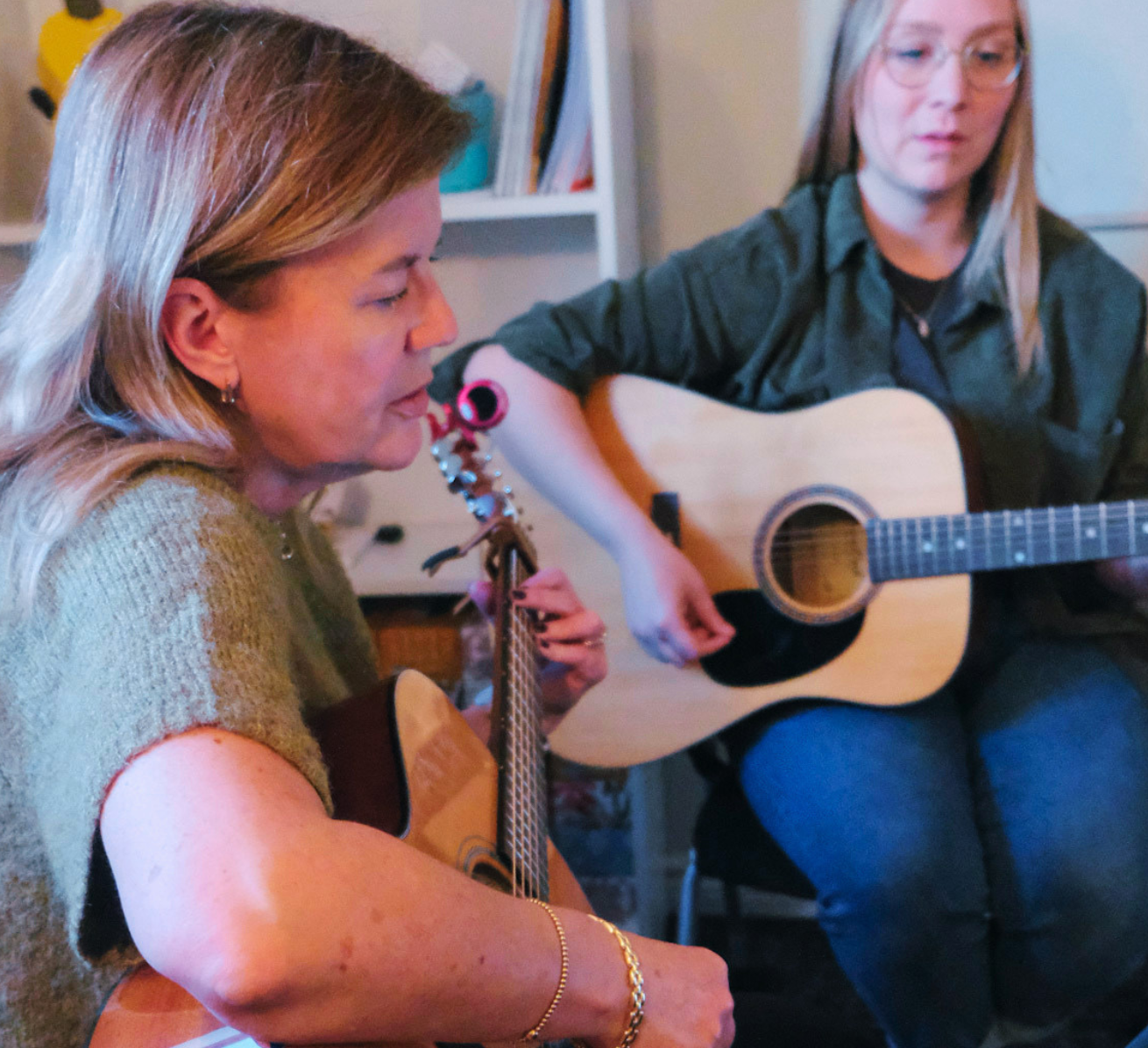 Adults in a Yellow Brick Music group class